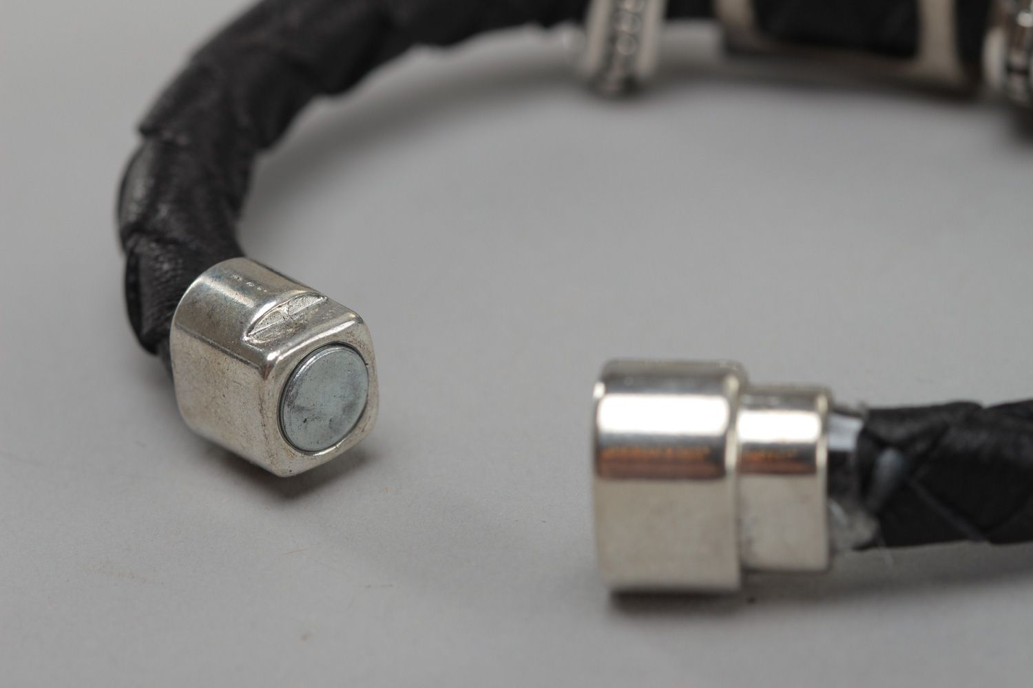 Handmade unisex genuine leather bracelet with metal charm photo 4