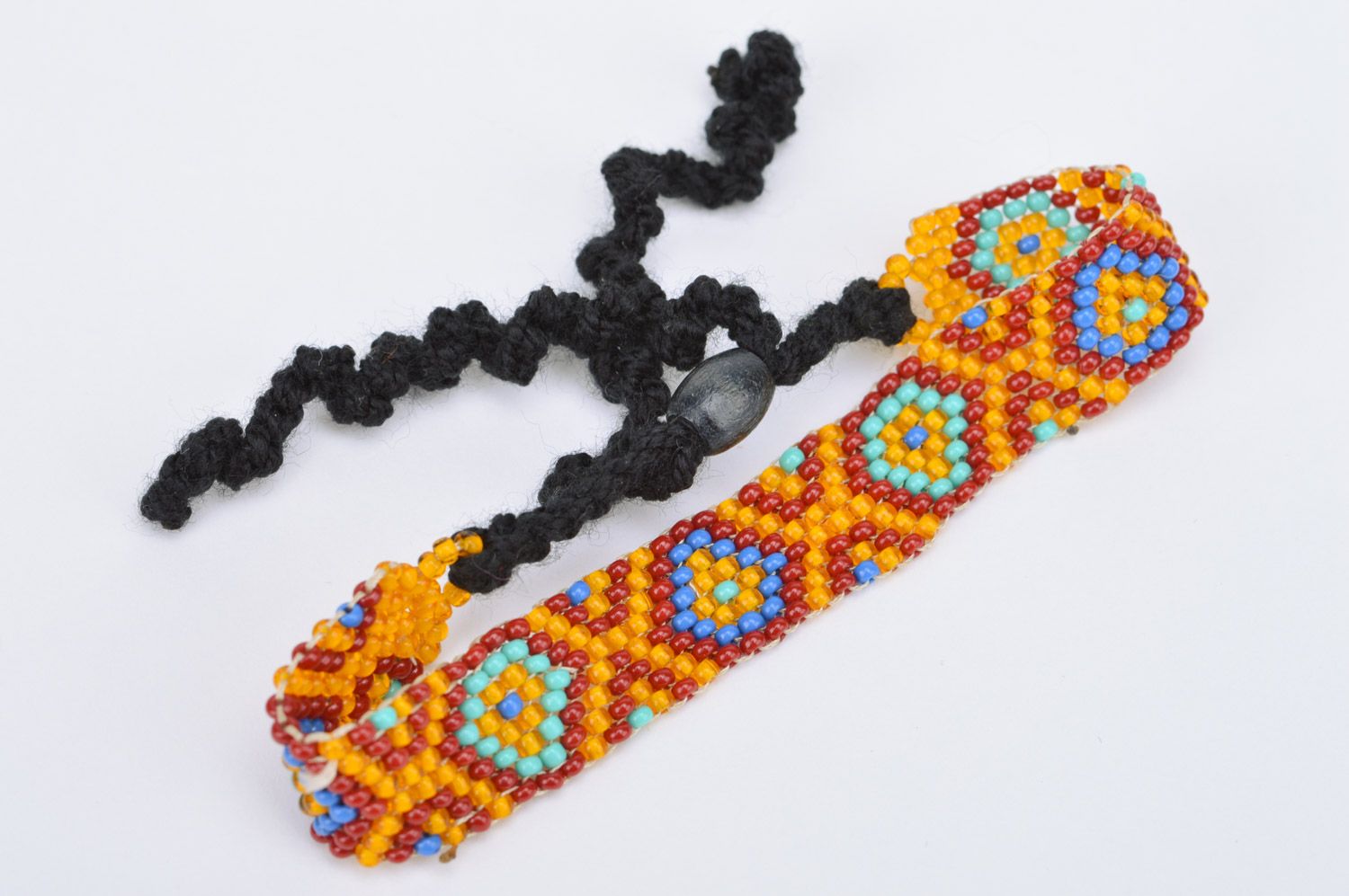 Handmade orange wrist bracelet woven of Czech beads with geometric ornament photo 5