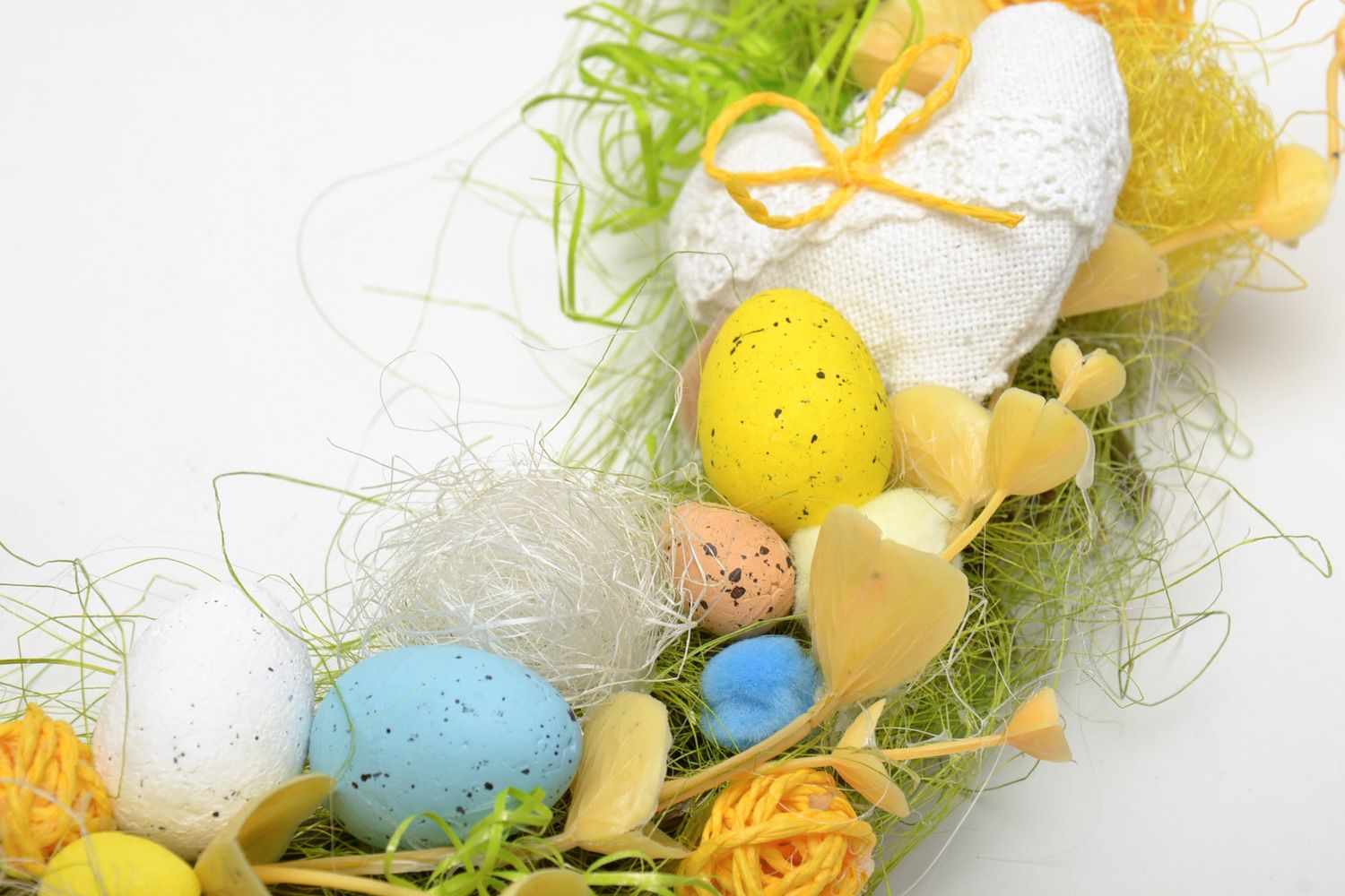 Handmade decorative Easter door wreath with little colorful eggs and feathers photo 3