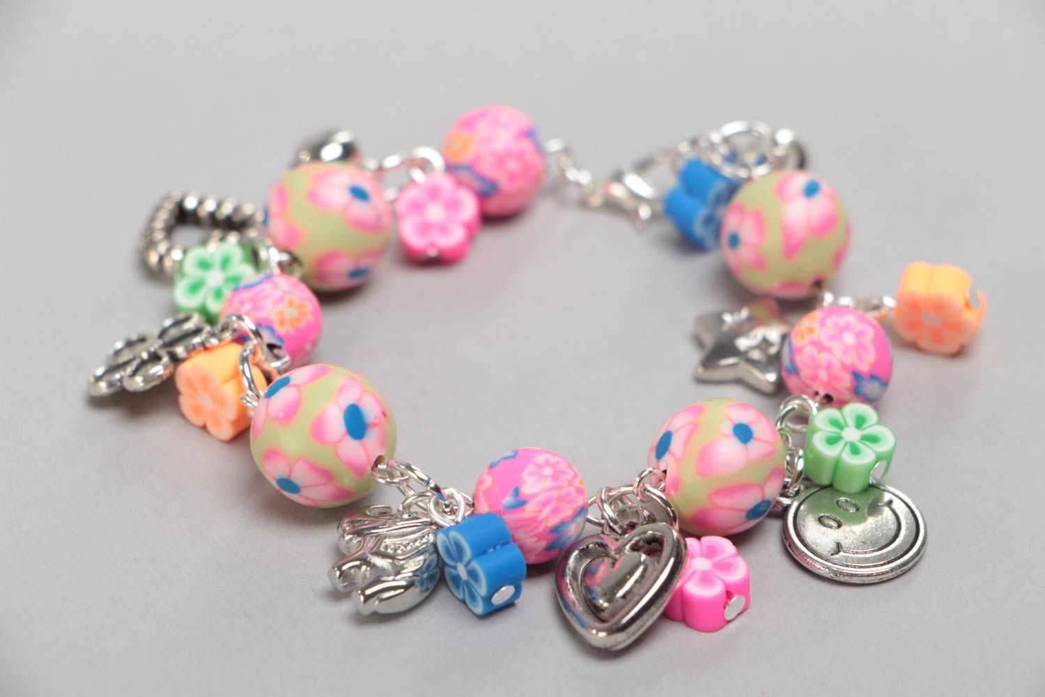 Handmade designer children's pink wrist bracelet with plastic and acrylic beads photo 2