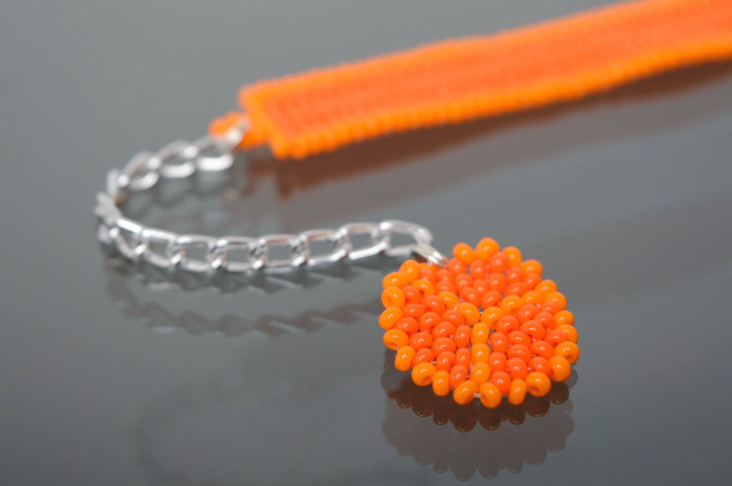 Orange handmade beaded bracelet with charm photo 2