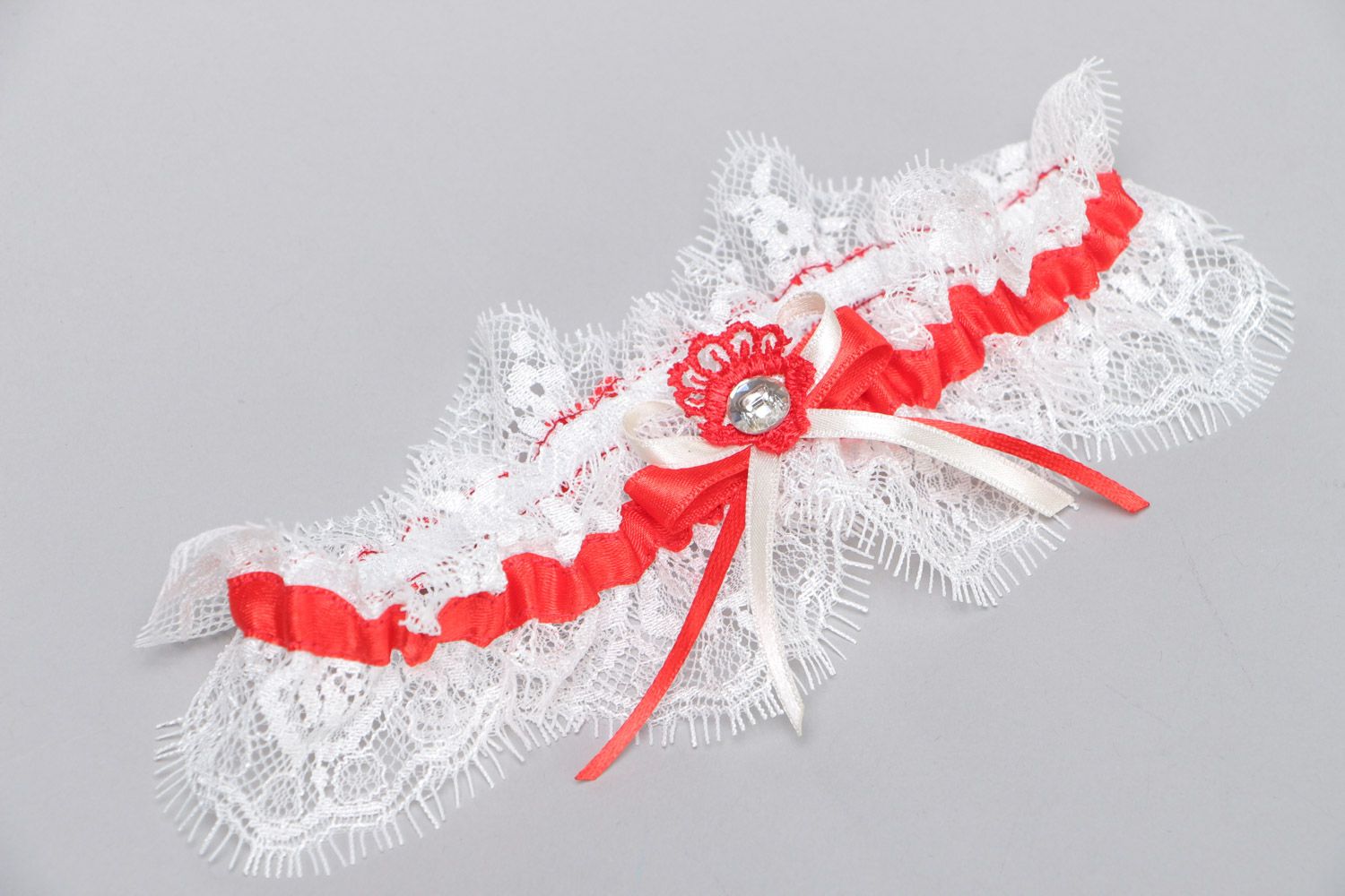 Handmade white wedding bridal garter with French lace and red satin ribbon photo 2