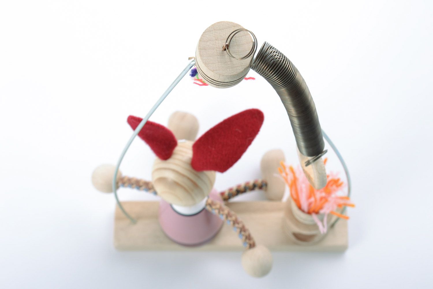 Деревянная игрушка заяц на лавке ручной работы с росписью фото 5