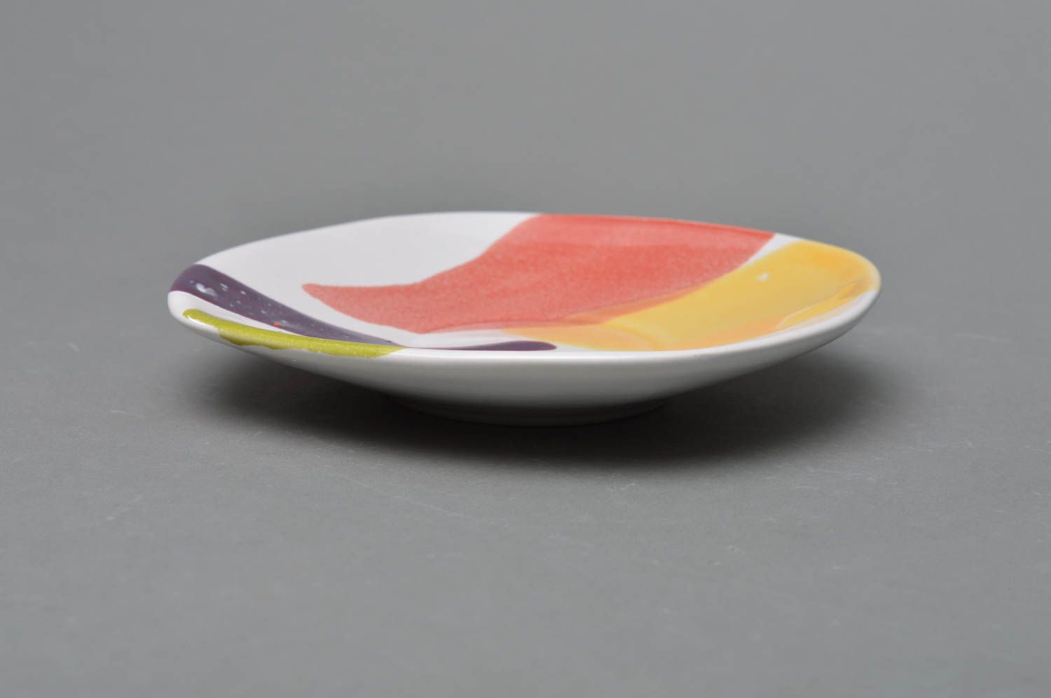 Handmade porcelain saucer with colored glaze painting with abstract pattern photo 1