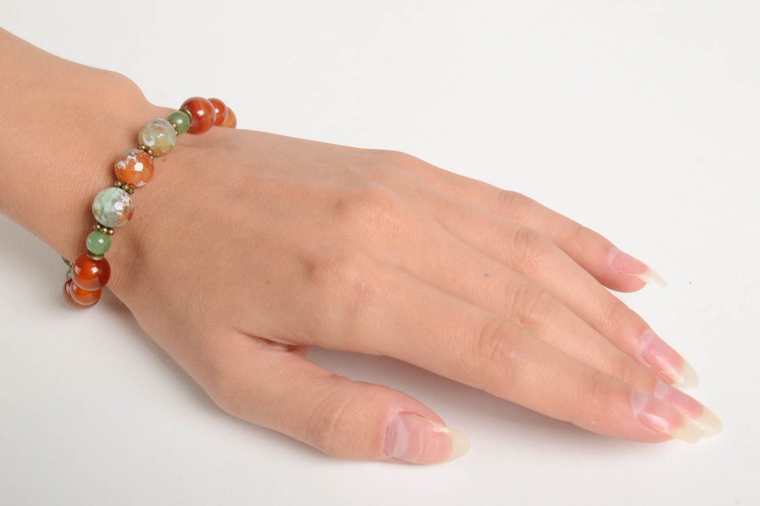 Stylish handmade gemstone beaded adjustable bracelet in pale green and orange color photo 2