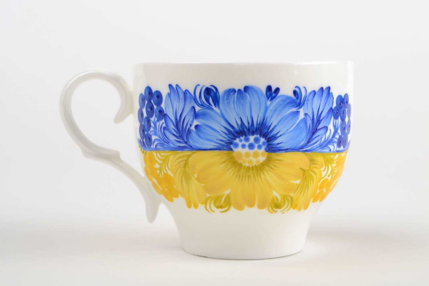 Porcelain teacup in white, yellow, and blue color with handle photo 5
