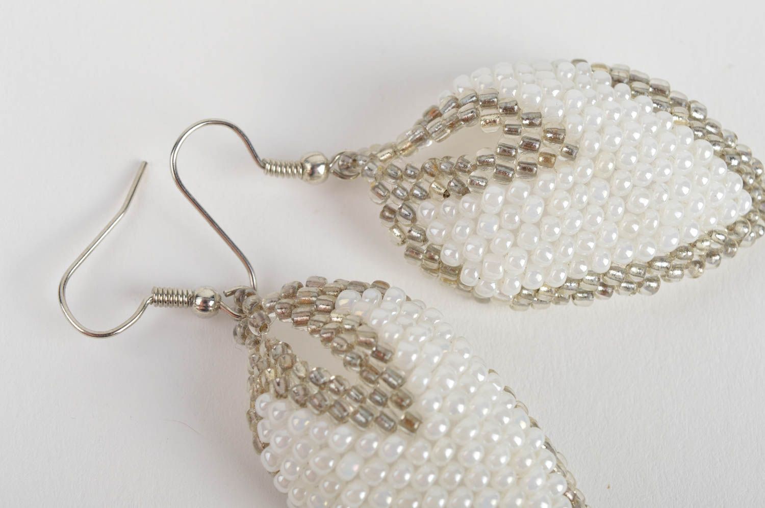 Handmade white and gray beaded woven dangle earrings in the shape of leaves photo 5