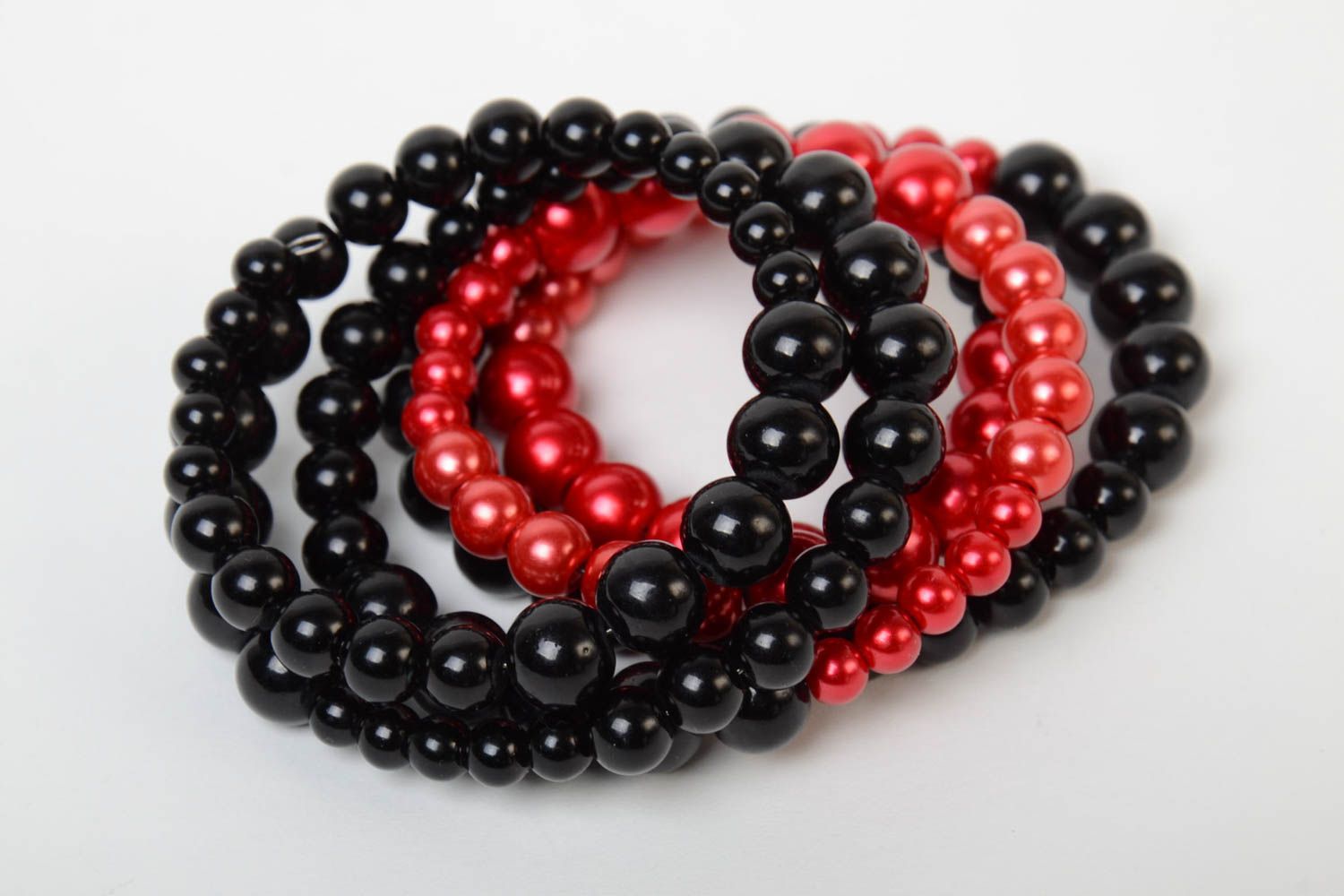 Red and black handmade designer wrist bracelet woven of plastic beads photo 5