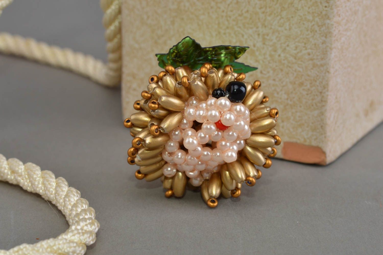 Small decorative designer handmade beaded animal figurine of golden hedgehog  photo 1