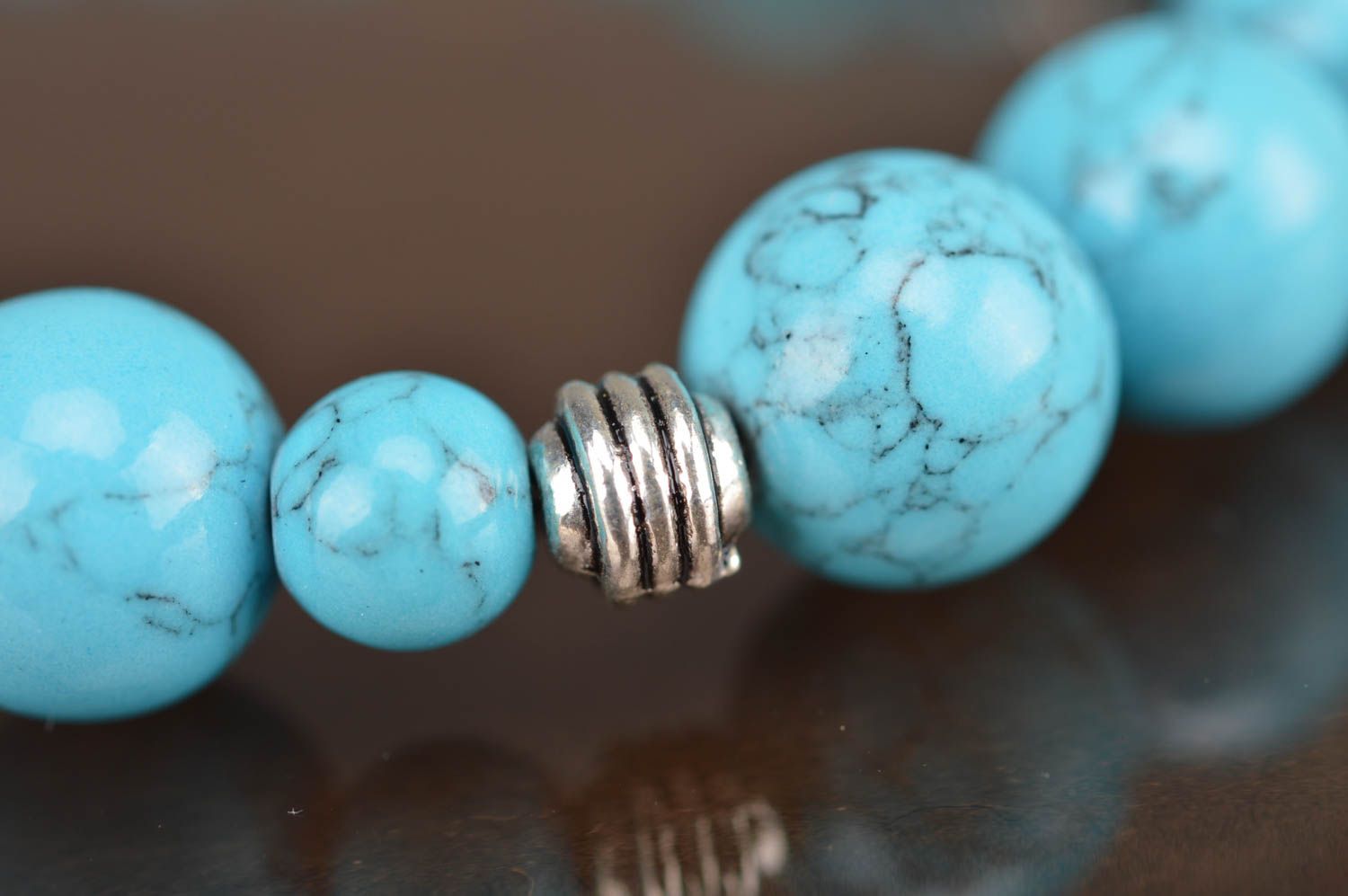 Blue handmade bracelet made of beads of turquoise color with separators photo 3