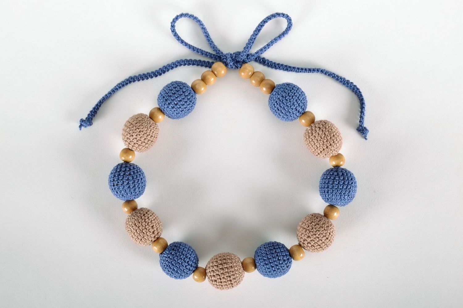 Handgemachte blau-braune Slingo Halskette aus Holzperlen foto 1