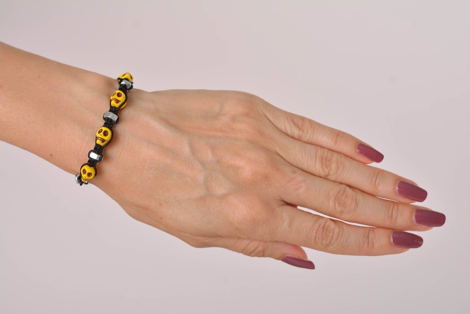 Handmade yellow skull beaded black cord bracelet with female screws photo 3