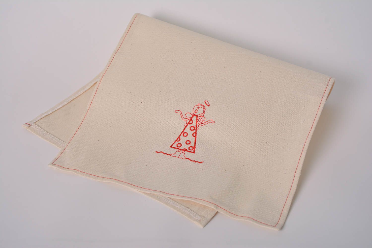 Handmade embroidered napkin made of semi linen for table layout Angel photo 1