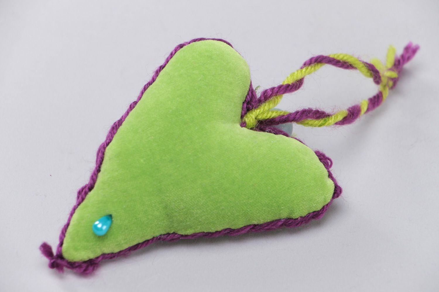 Small handmade heart-shaped wall hanging sewn of green velor for interior decor photo 3