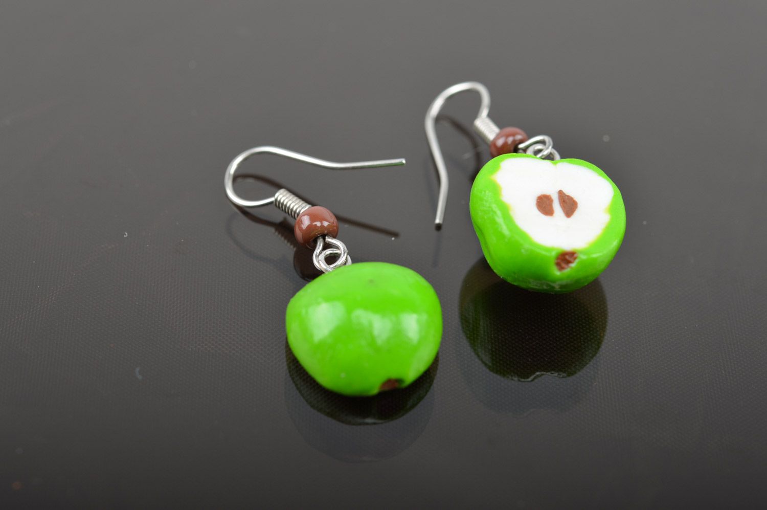 Bright lime and white handmade polymer clay earrings with charms in the shape of apple halves photo 3