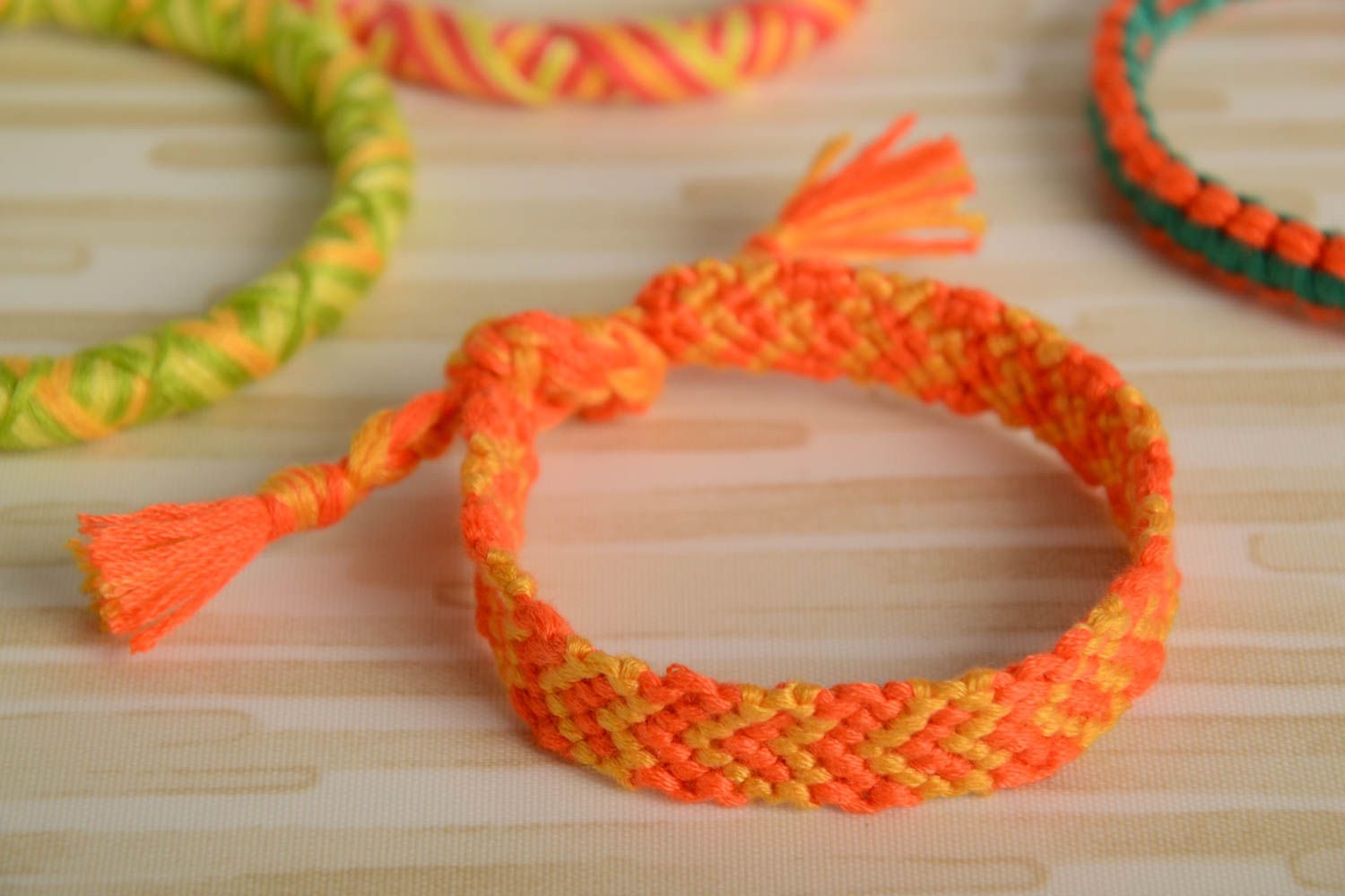 Handmade wrist friendship bracelet woven of orange embroidery floss for women photo 1