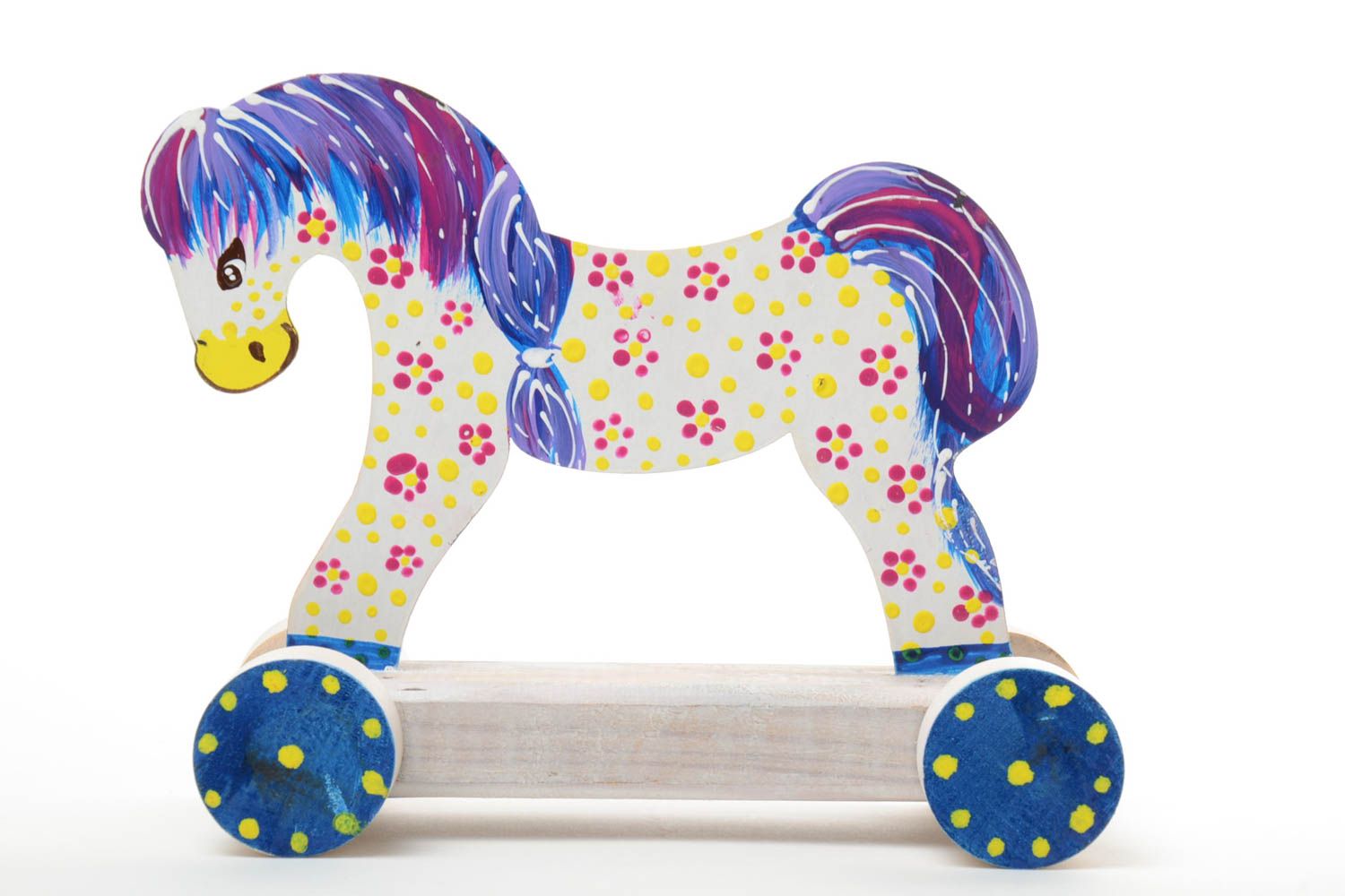 Bright painted handmade wooden wheeled toy of light color Horse for children photo 1