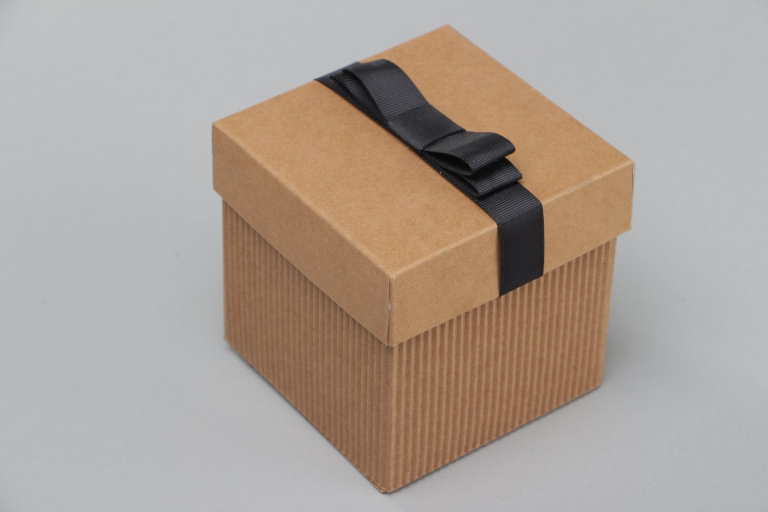 Handmade stylish corrugated carton gift box with black rep ribbon bow on lid photo 3