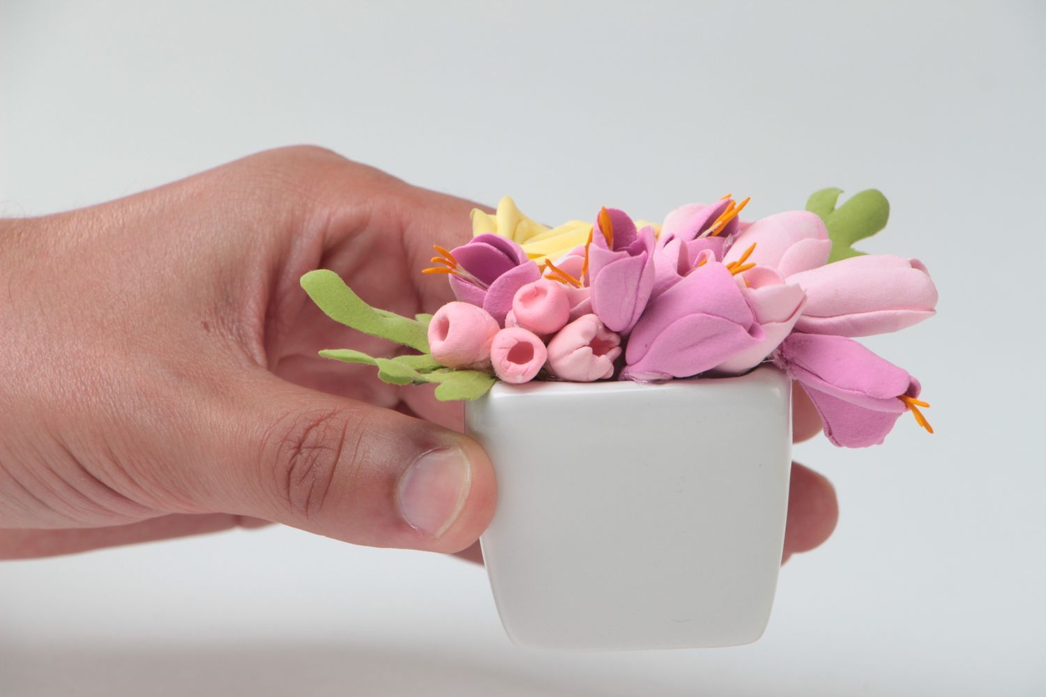 Beautiful handmade pink polymer clay flowers in pot interior composition photo 5