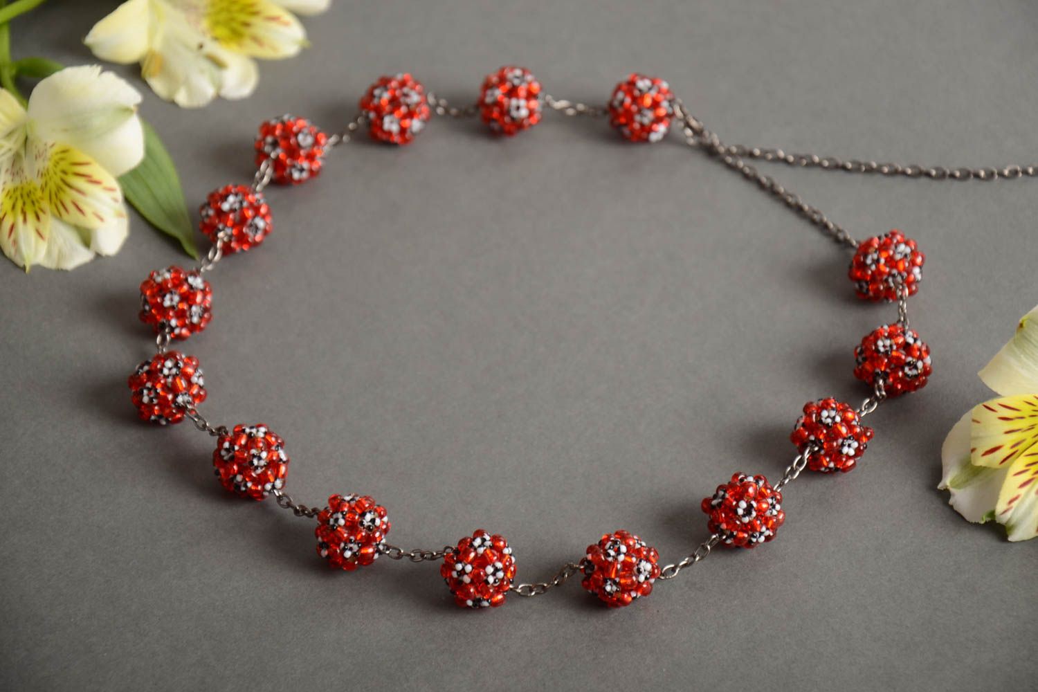 Handmade designer women's necklace on metal chain with red bead woven balls  photo 1