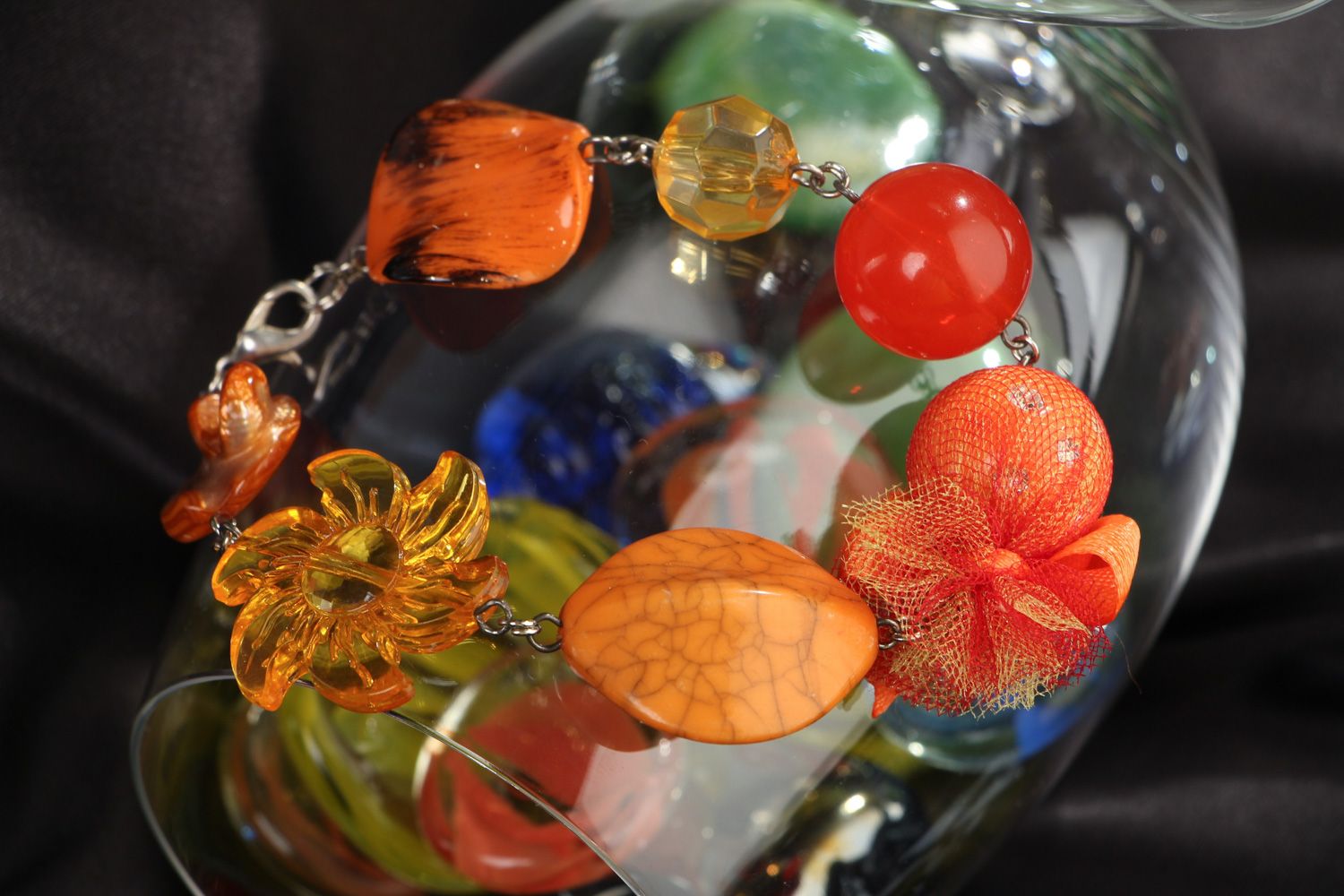 Bright handmade wrist bracelet with orange plastic beads of different shapes photo 4