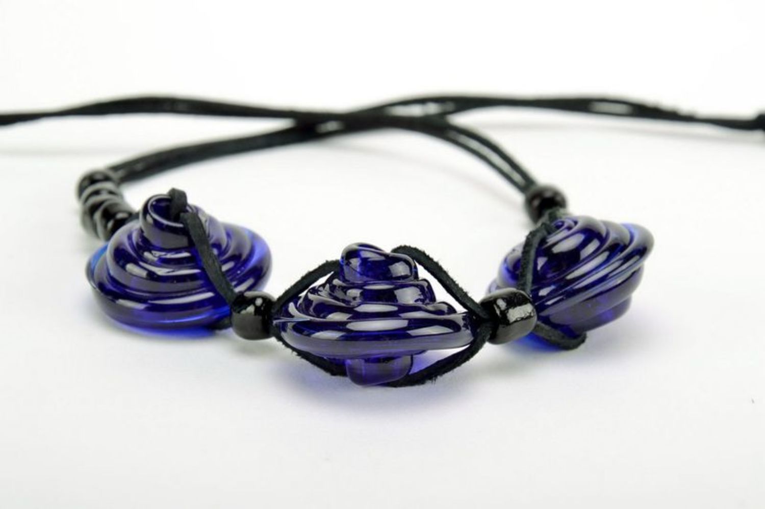 Dark blue tough glass necklace with leather cord photo 1