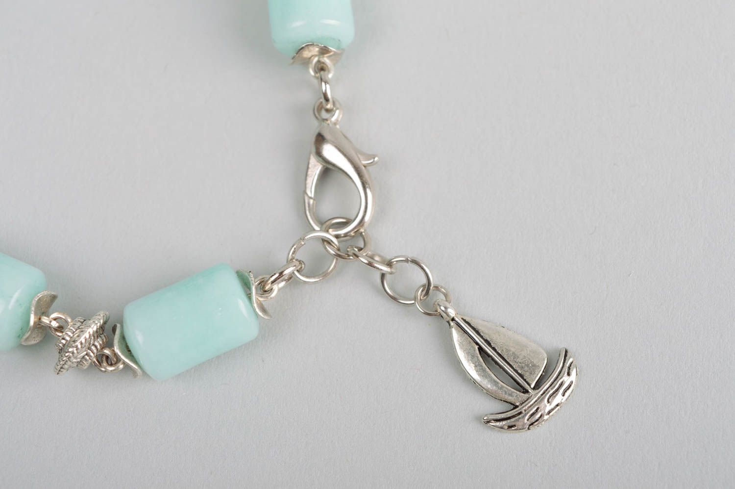 Handmade designer aquamarine gemstone bracelet with metal charms photo 4