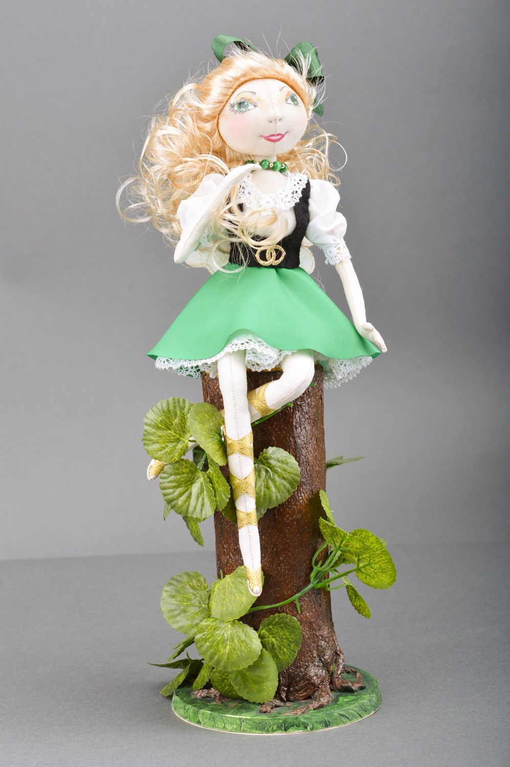 Beautiful handmade designer doll sewn of fabric and lace Elf sitting on stub photo 1