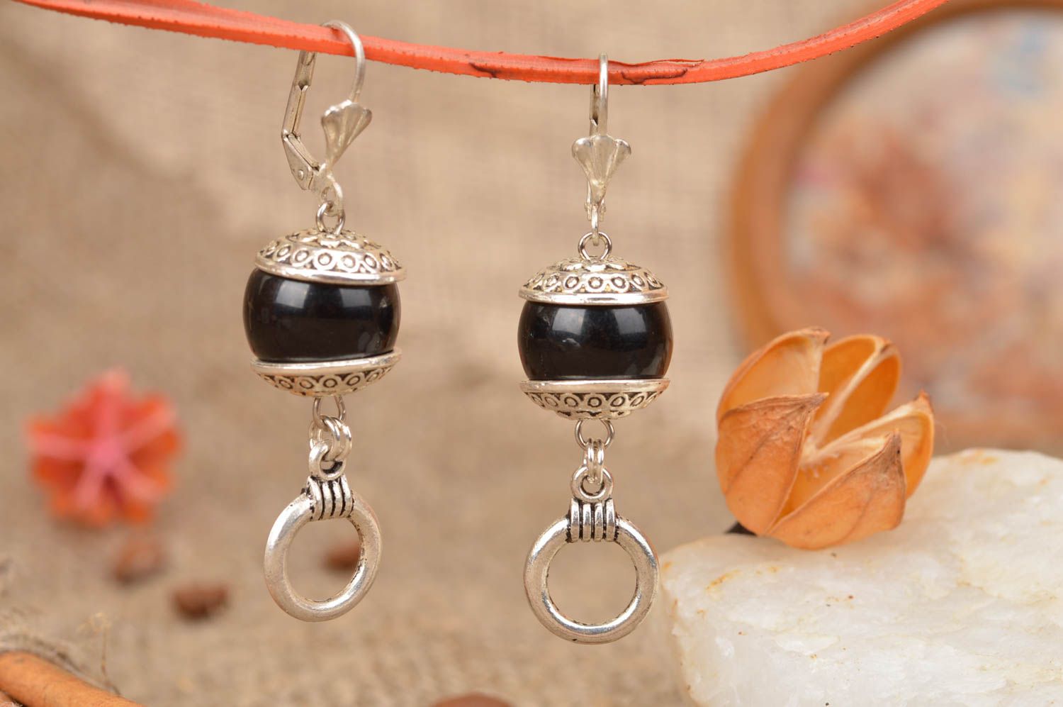 Handmade silver colored metal dangle earrings with black beads in ethnic style photo 1