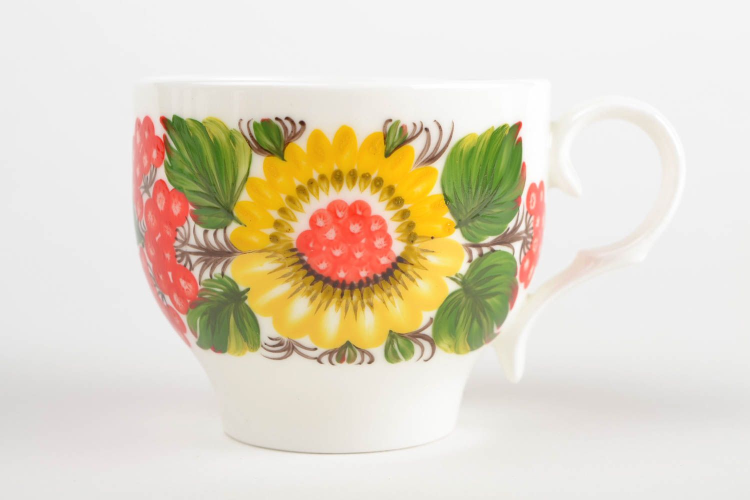 White porcelain handmade teacup with bright Russian-style floral pattern in green, red, and yellow color photo 3