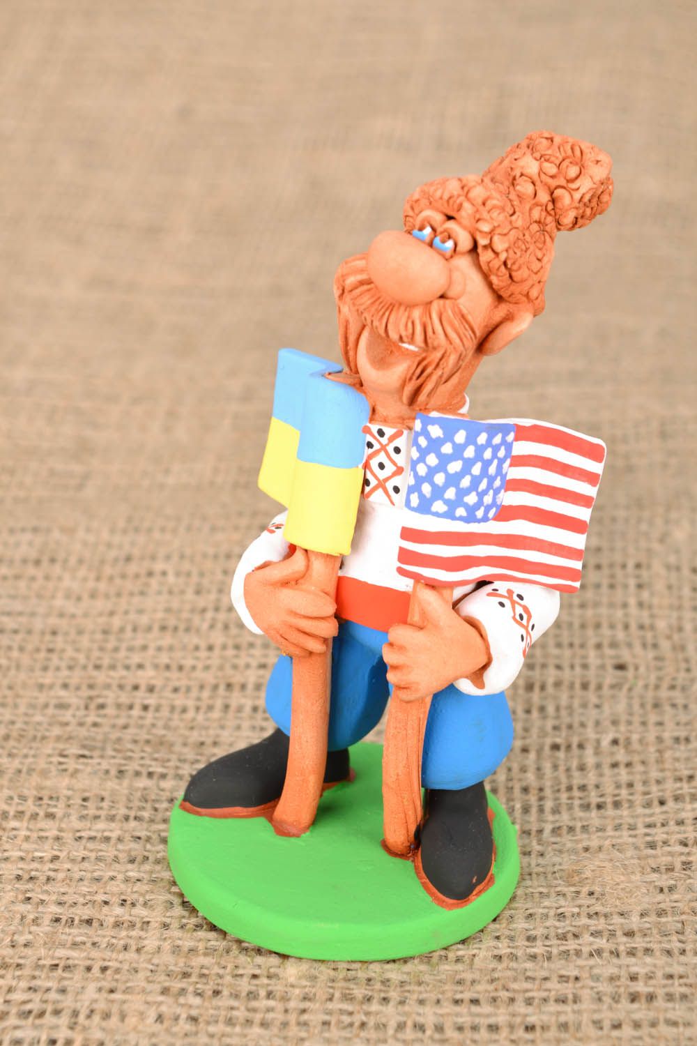 Clay statuette Cossack with Two Flags photo 1