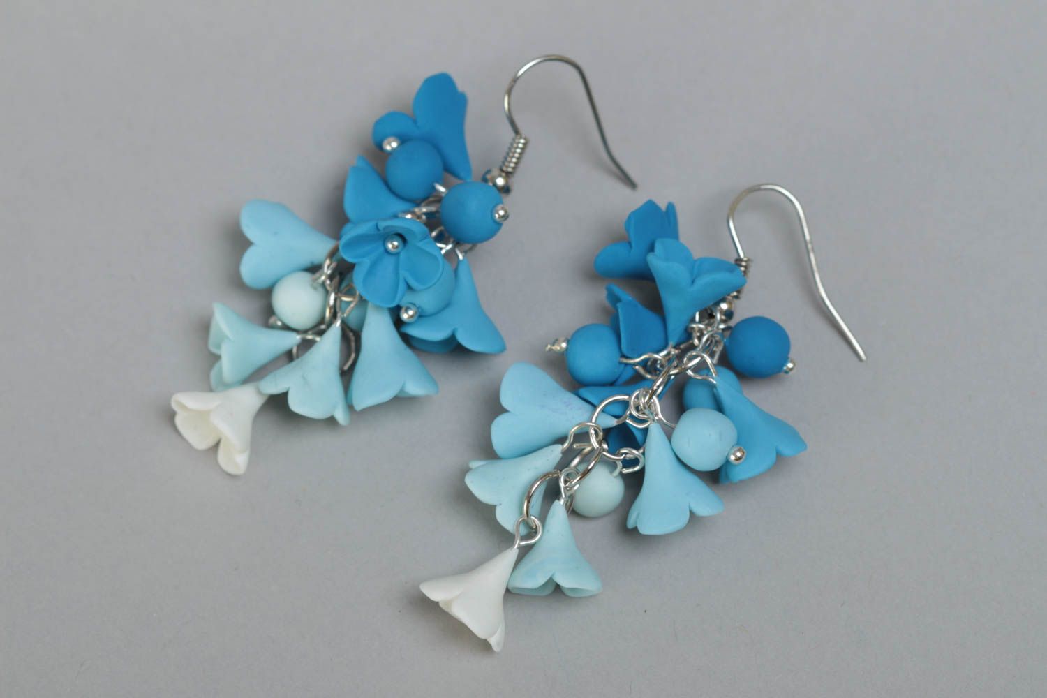 Handmade designer polymer clay flower dangle earrings in blue color palette photo 2