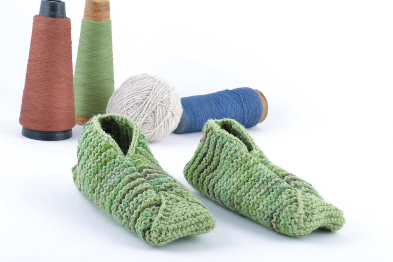 Light green warm hand knitted wool house slippers for adults and children photo 1