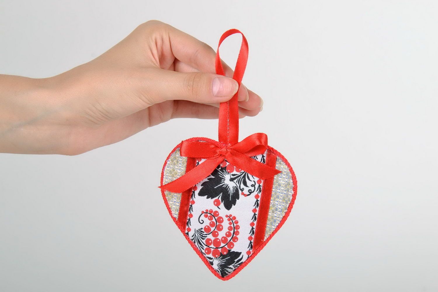 Heart-shaped amulet with ethnic embroidery photo 2