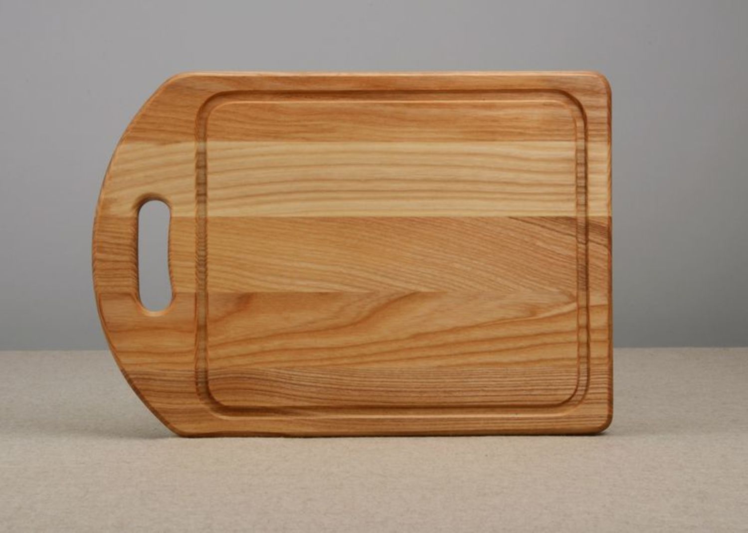 A wooden cutting board photo 3