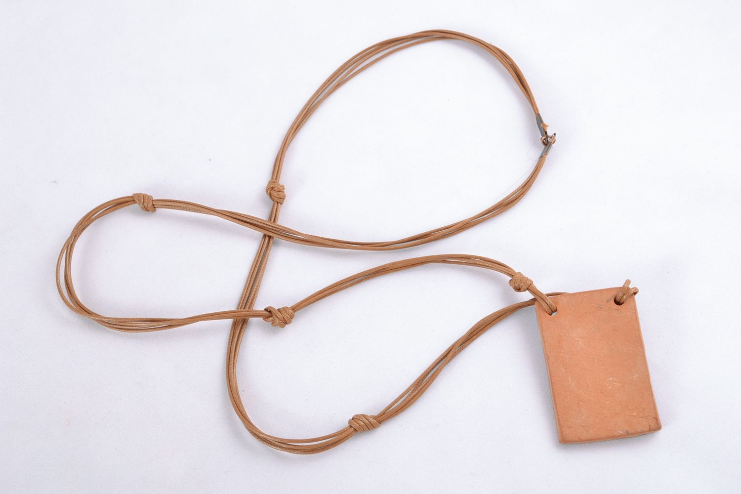 Handmade rectangular ceramic pendant with embossing photo 4