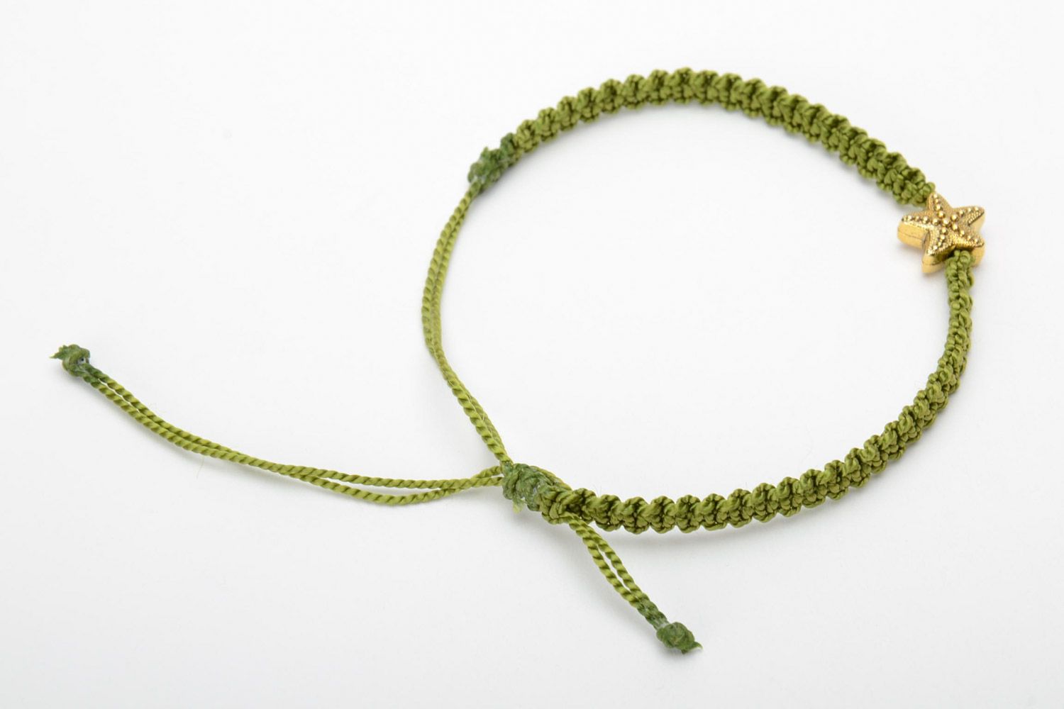 Handmade women's macrame woven bracelet of green color with charm in the shape of star photo 4