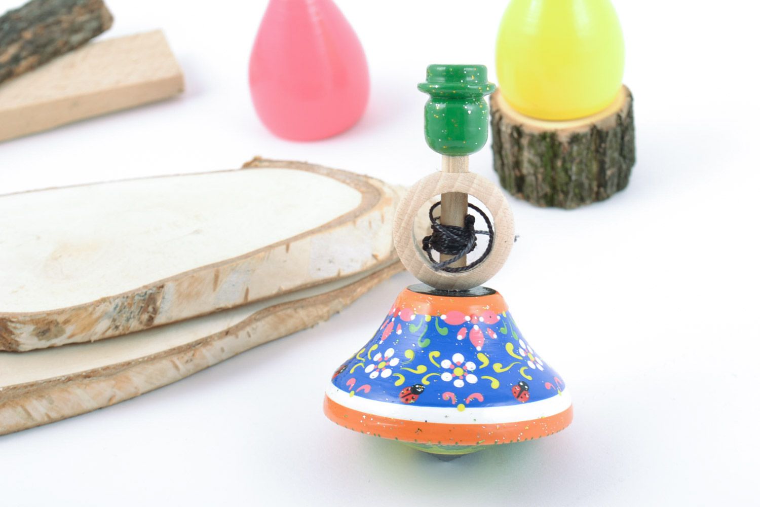 Children's handmade wooden spin top toy painted with eco dyes photo 1