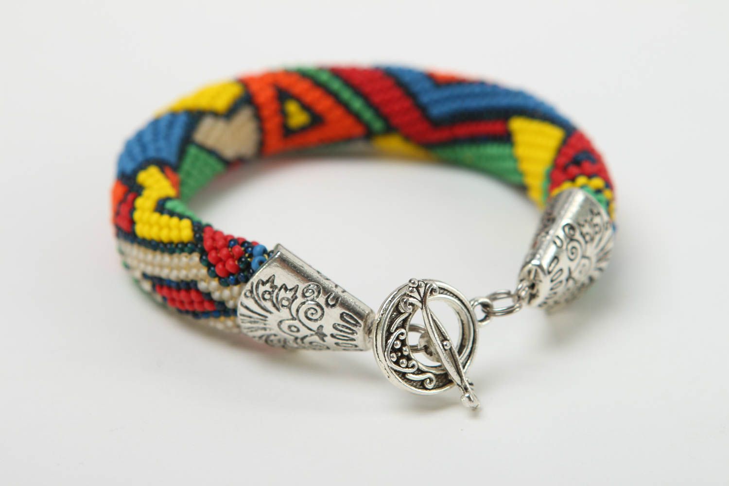 Handmade beaded cord bracelet in geometric style and metal fittings photo 3