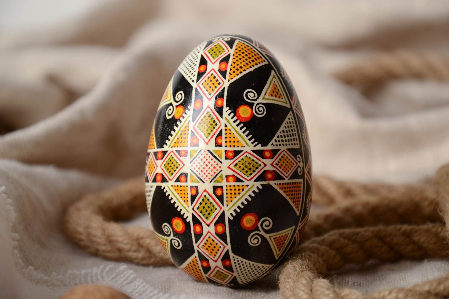 Handmade decorative dark painted goose egg with geometric ornament Easter souvenir photo 1