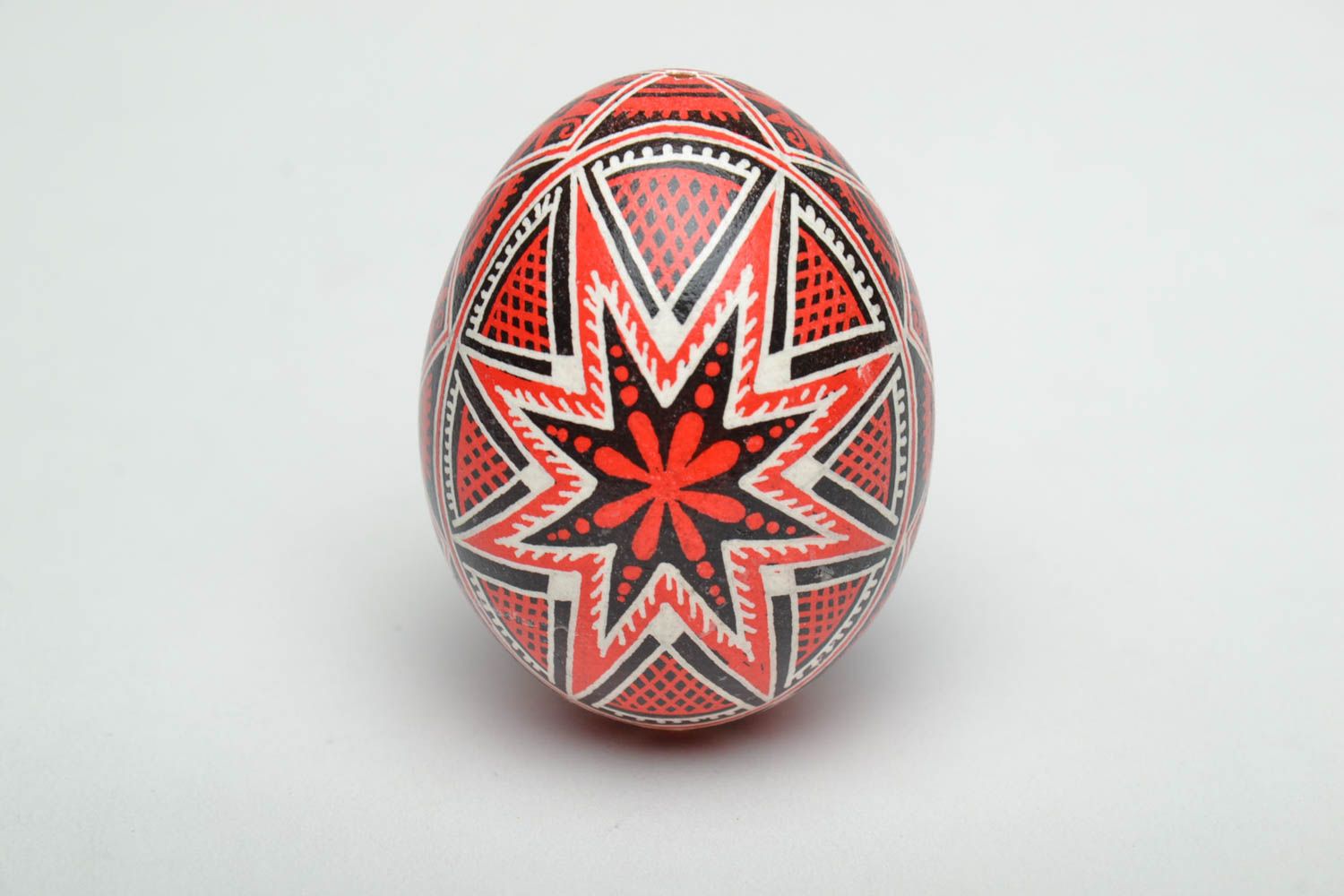 Handmade Easter egg painted with red and black colors photo 2