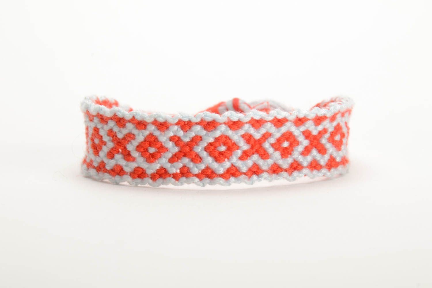 Red and white handmade bright thin bracelet woven of embroidery floss photo 3