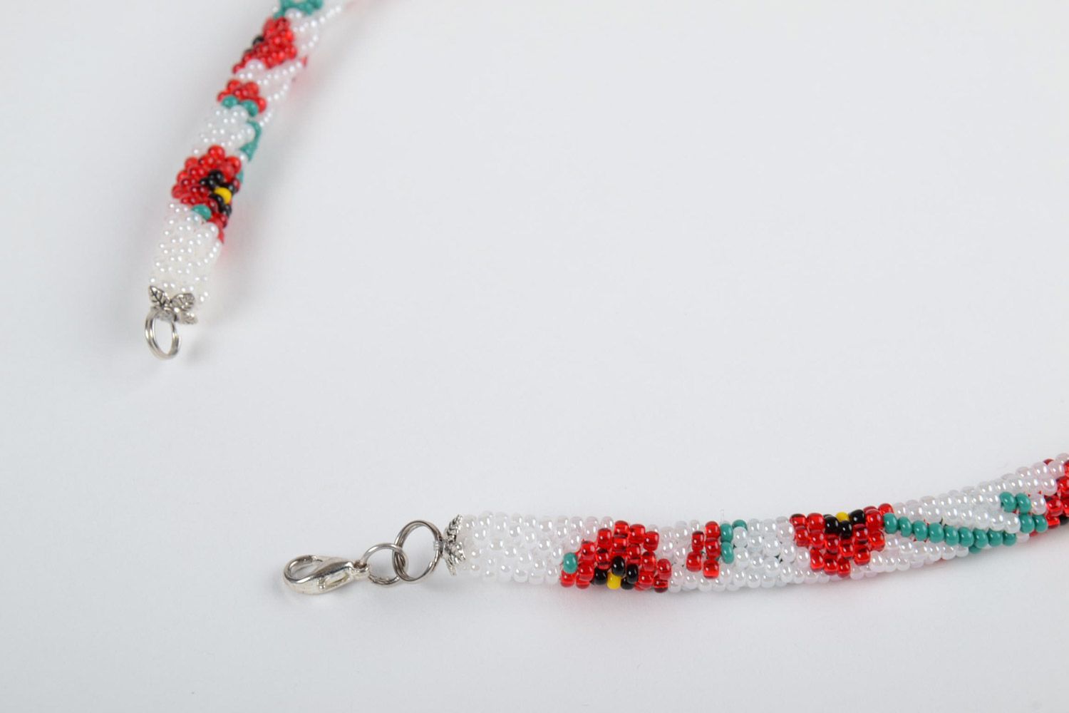 Beautiful gentle handmade beaded cord necklace of white color with flower print photo 3