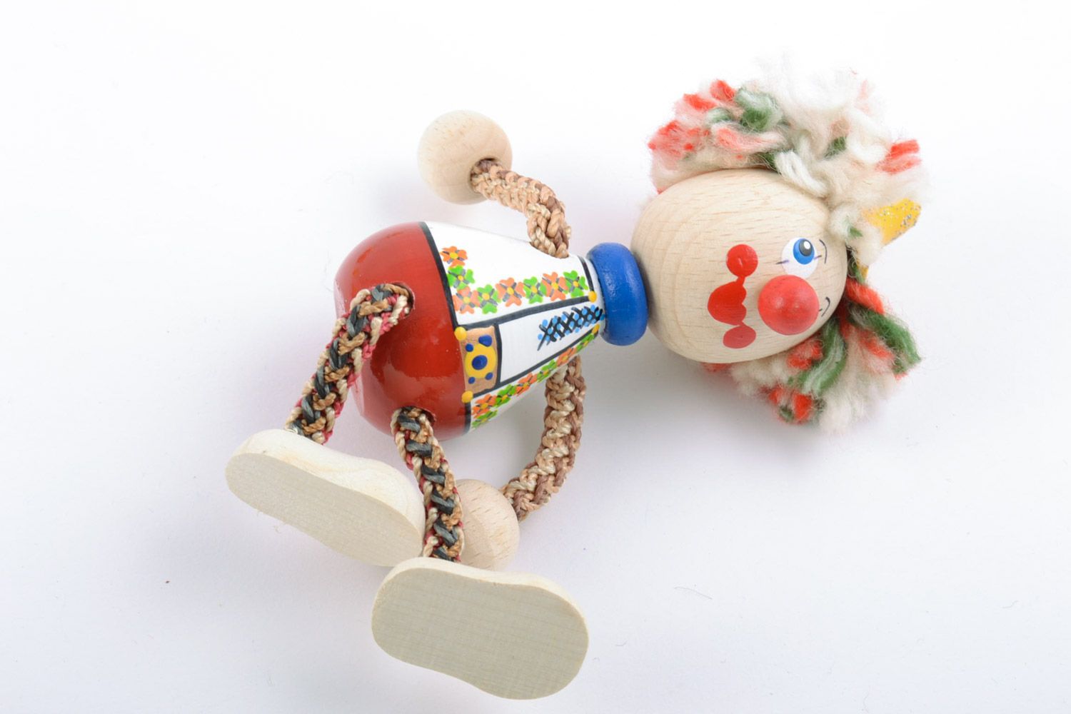 Bright homemade painted wooden toy in the shape of clown photo 4