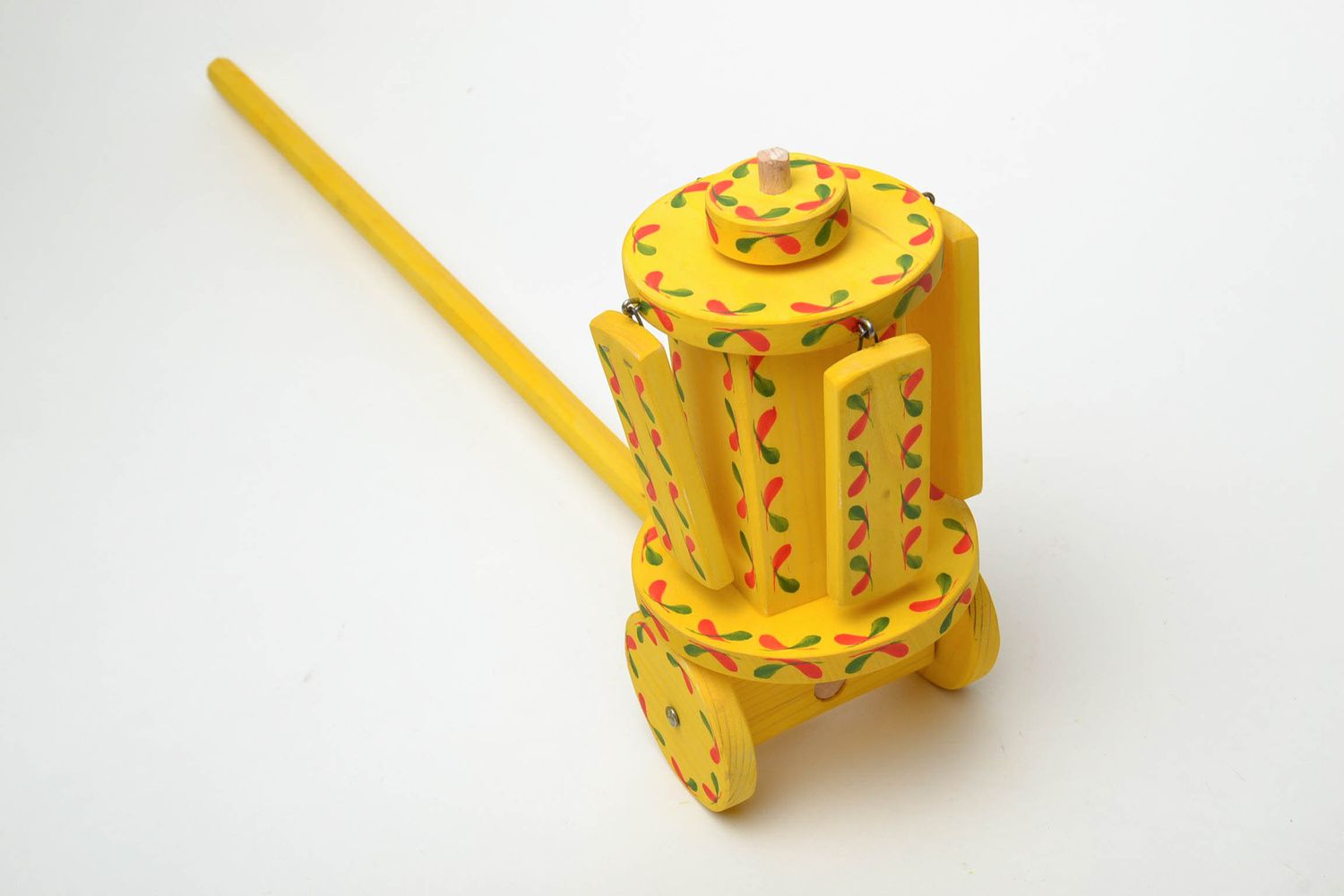 Painted wooden toy with wheels  photo 4