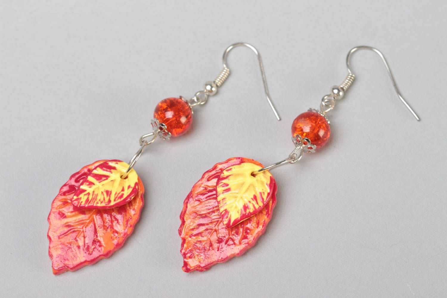 Handmade polymer clay dangling earrings with bright orange leaves with beads photo 2