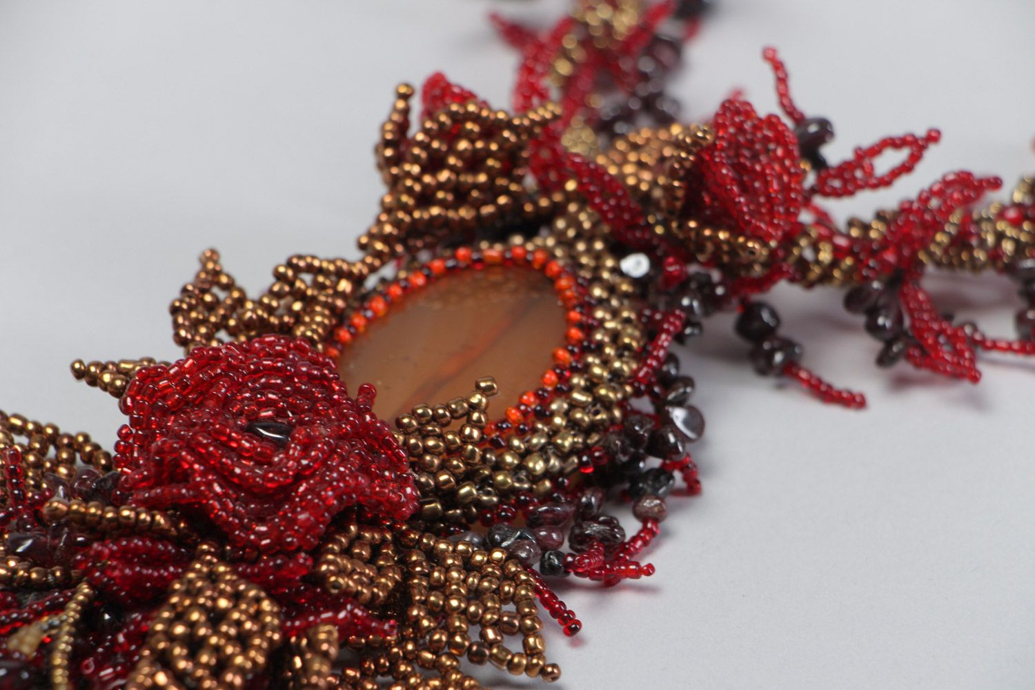 Handmade dark red floral necklace woven of seed beads and natural stones  photo 4