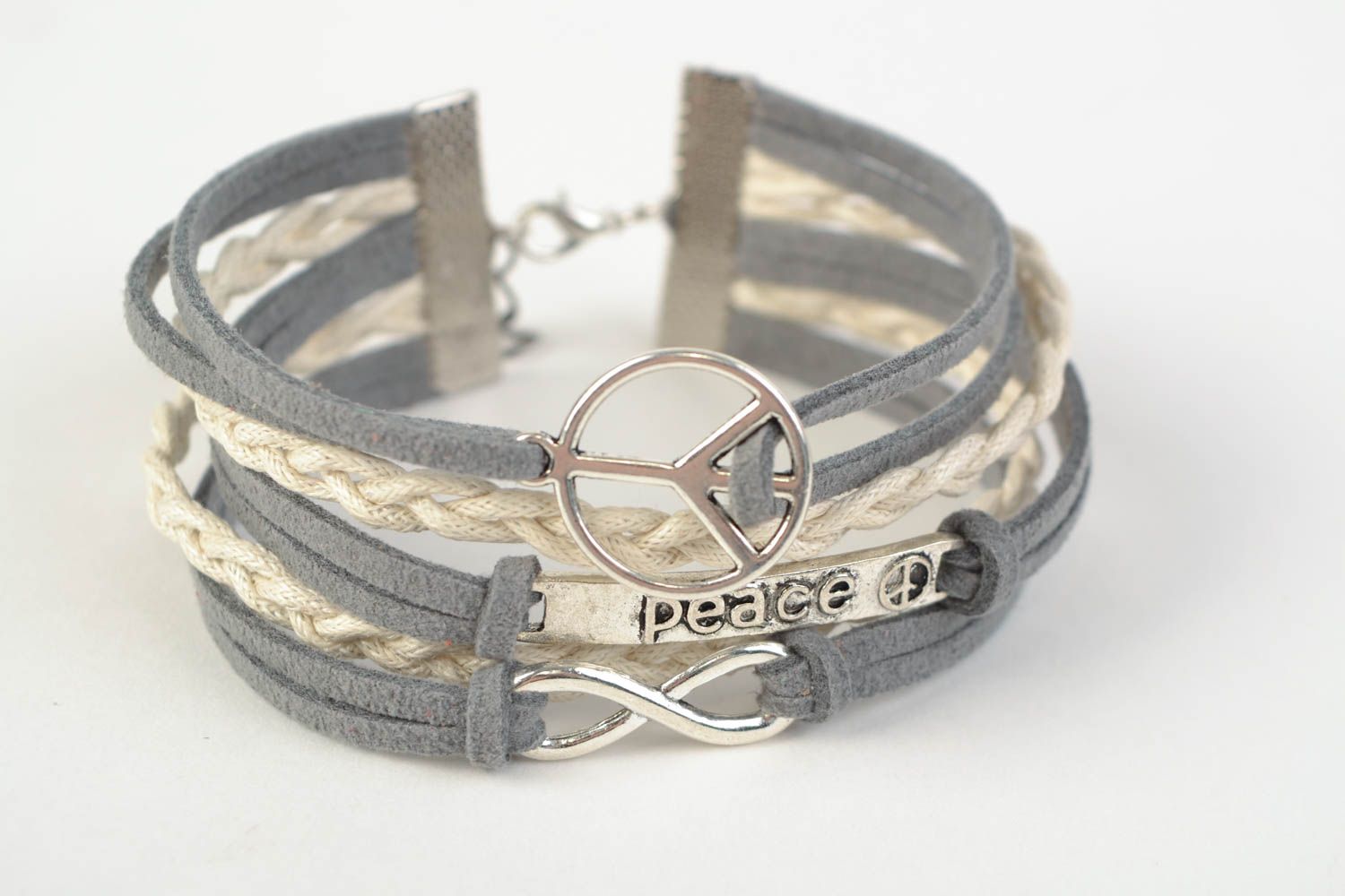 Gray and white handmade woven suede cord bracelet with pacific sign photo 3