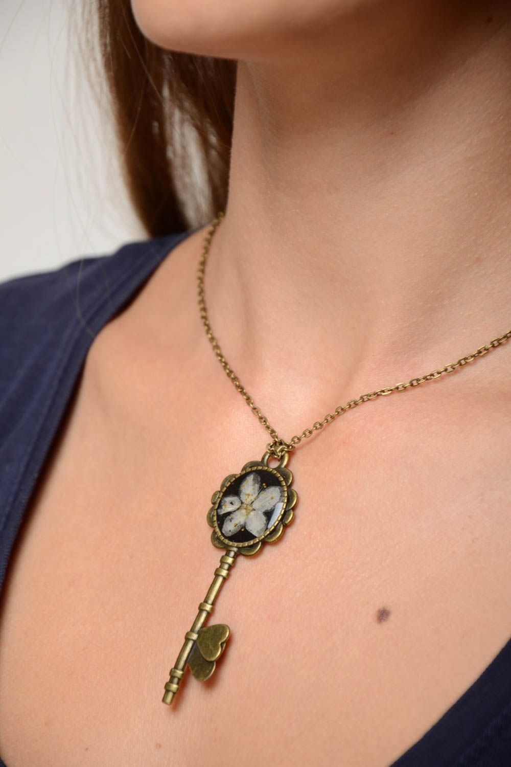 Handmade designer botanical pendant on metal basis coated with epoxy Key photo 5