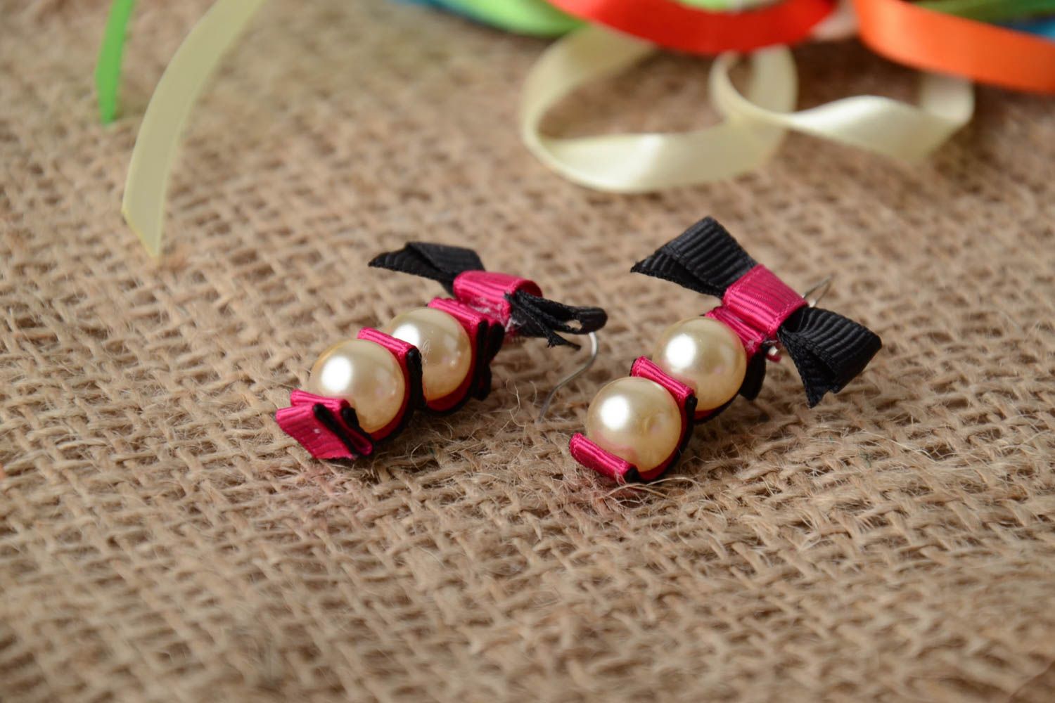 Handmade black and pink dangling earrings with rep ribbon bows and plastic beads photo 1